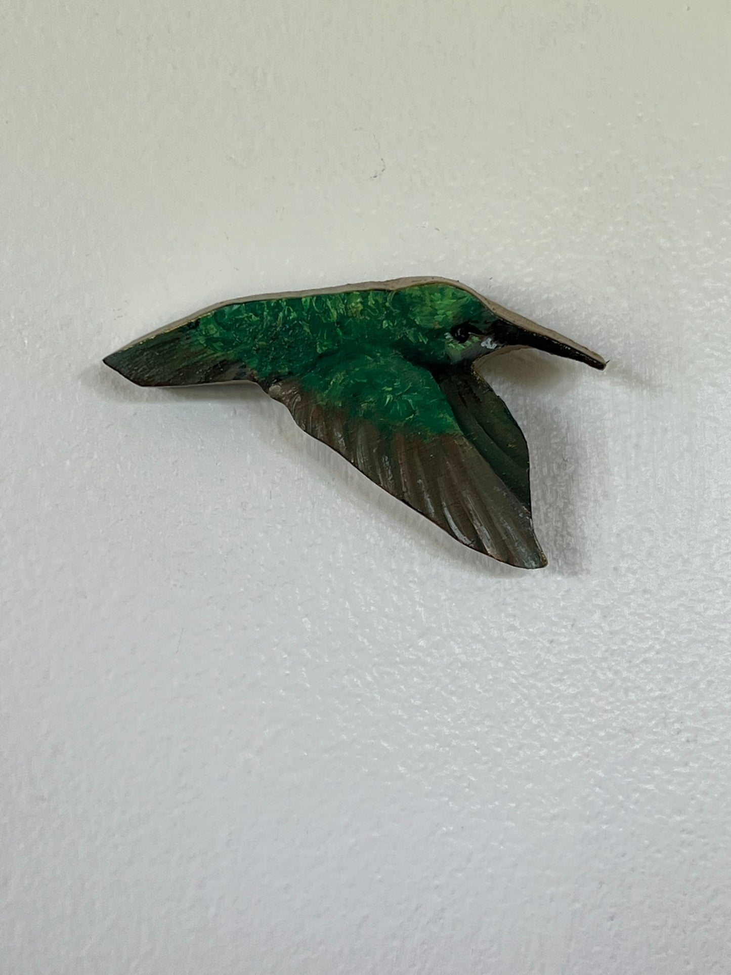 Hummingbird in flight with wings down